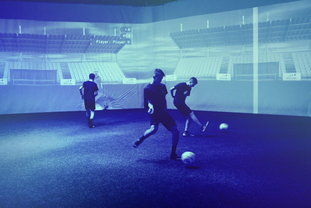 Three youth players in a parallel passing exercise during a free trial at skills.lab