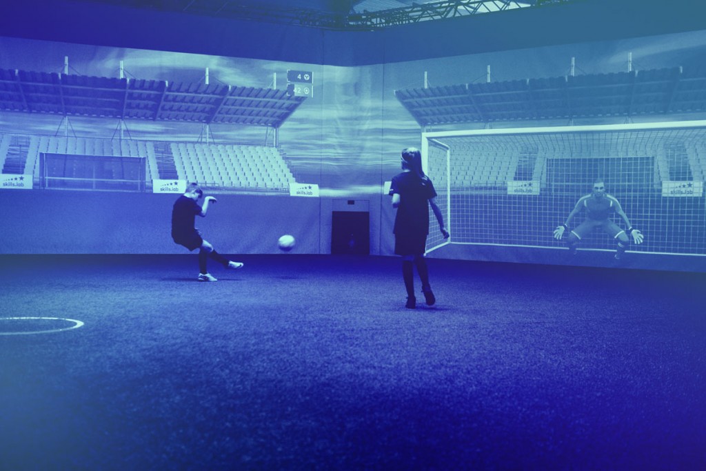 Two kids in an exclusive training during a passing and shooting exercise