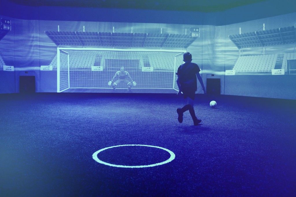 A kid shooting on goal during an exclusive training
