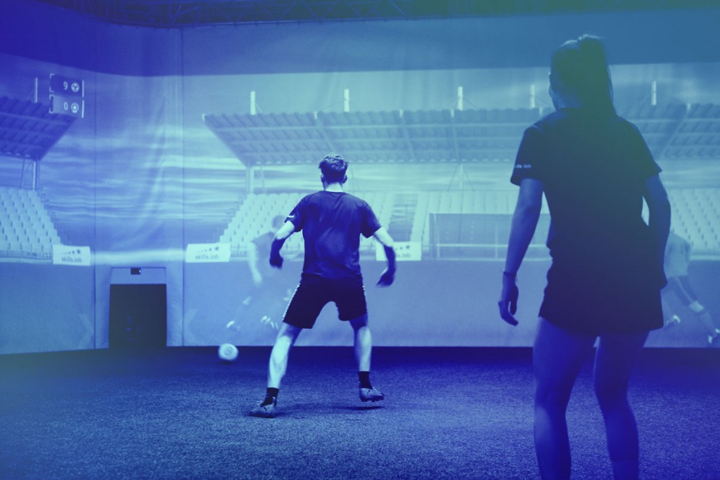 Two players in the skills.lab Arena during a passing exercise